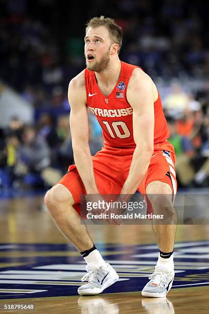 Trevor Cooney of the Syracuse Orange reacts in the second half against the North Carolina Tar Heels during the NCAA Men's Final Four Semifinal at NRG...