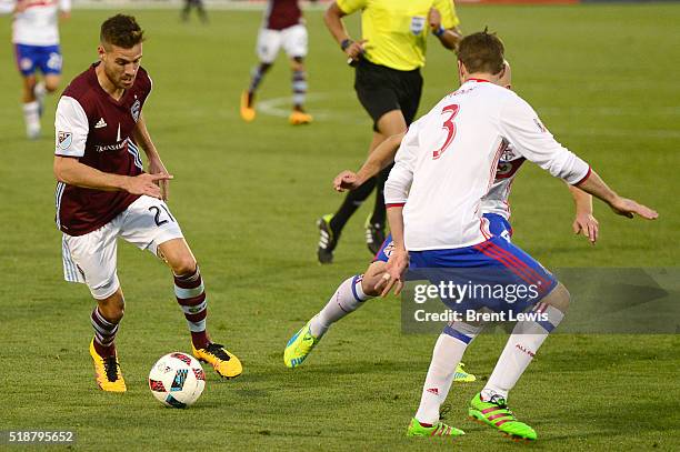 Colorado Rapids forward Luis Solignac looks for a way around Toronto FC defender Drew Moor during the second half at Dick's Sporting Goods Park on...