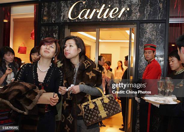 Local celebrities attend the opening ceremony of Cartier's new flagship store on December 18, 2004 in Shanghai, China. Luxury brands like Armani,...