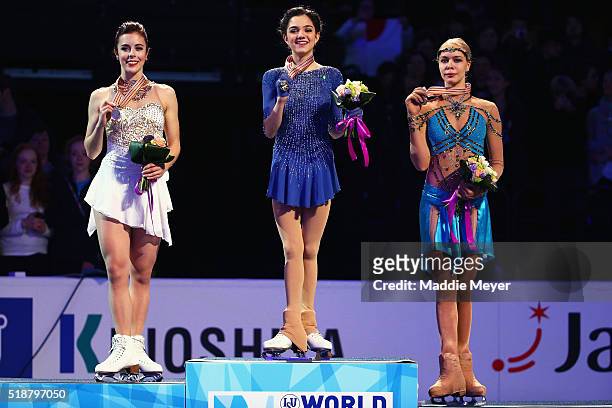From left, silver medalist Ashley Wagner of the United States, gold medalist Evgenia Medvedeva of Russia, and bronze medalist Anna Pogorilaya of...