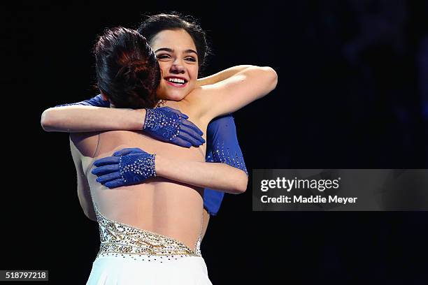 Gold medalist Evgenia Medvedeva of Russia, right, congratulates silver medalist Ashley Wagner of the United States on the podium following their...