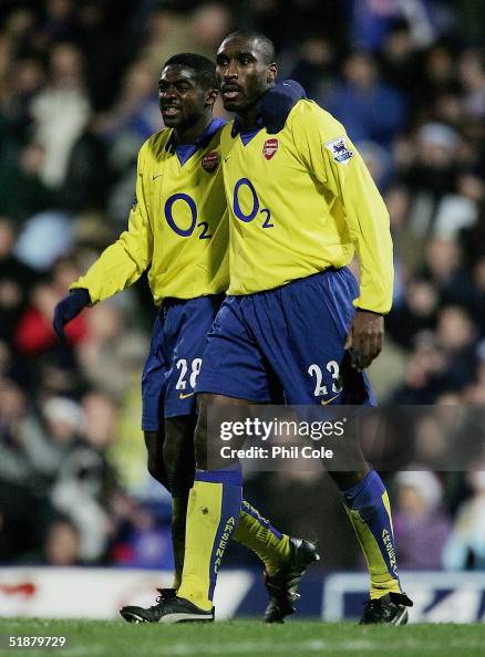 Kolo Toure congratulates Sol Campbell, the goal scorer, at the end of
