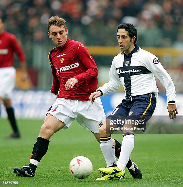 Daniele de Rossi of Roma and Domenico Morfeo of Parma in action during the Serie A match between Roma and and Parma at the Olympic stadium on...