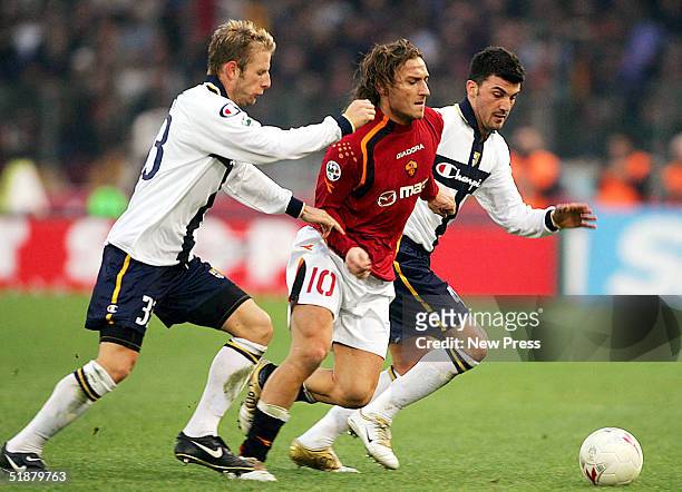 Francesco Totti of Roma and Vincenzo Grella of Parma in action during the Serie A match between Roma and and Parma at the Olympic stadium on December...
