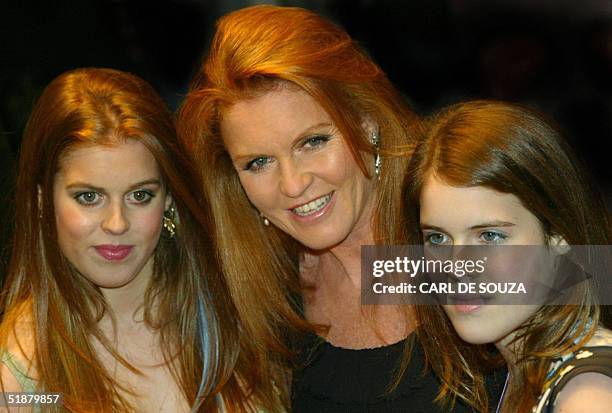 Sarah Ferguson, Duchess of York arrives 19 December 2004 at the Odeon cinema, Leicester Square, in London with daughters Princess Beatrice and...