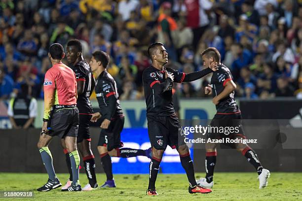 Juan Medina of Atlas celebrates with teammates after scoring his team's second goal during the 12th round match between Tigres UANL and Atlas as part...