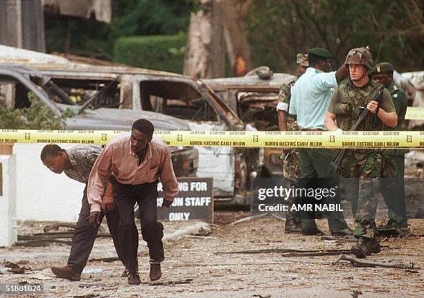 File photo taken 08 August 1998 shows a US soldier standing guard in front of the US embassy, the site of the 07 August bomb blast that killed eight...