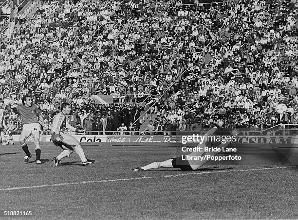 Juan Manuel Asensi of Spain beats Sweden's goalkeeper Ronnie Hellström to score the winning goal in the 75th minute of a World Cup Group 4 match at...