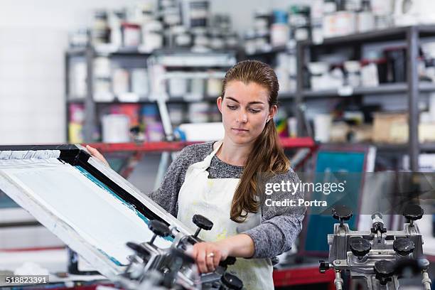 Screen Printing Machine Photos and Premium High Res Pictures - Getty Images