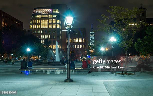 washington square park at night - new york university stock-fotos und bilder