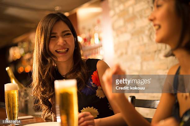 women with glee at the restaurant - luxury club stock pictures, royalty-free photos & images