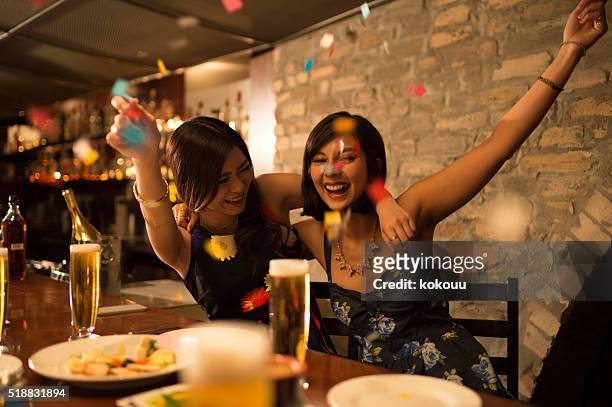 women who are raised in a birthday party - luxury club stock pictures, royalty-free photos & images