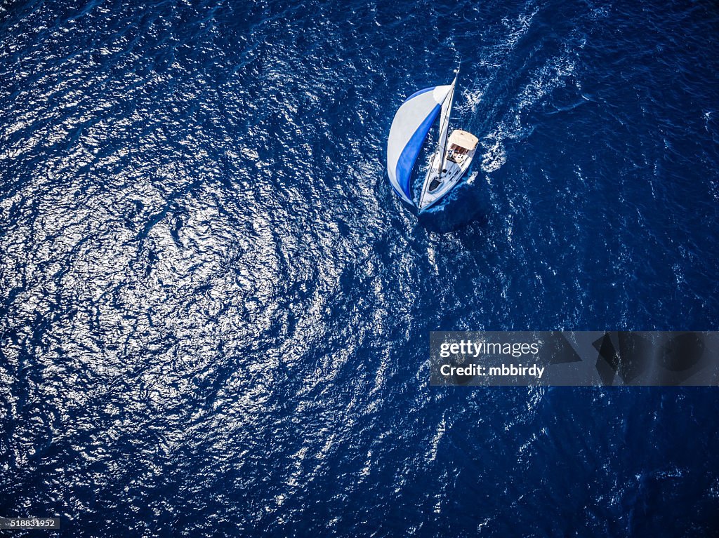 Sailing with sailboat, view from drone