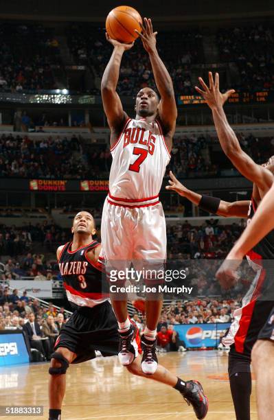 Ben Gordon of the Chicago Bulls shoots a running jumper over Damon Stoudamire of the Portland Trailblazers at the United Center on December 20, 2004...