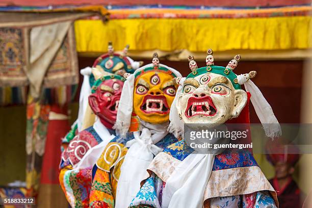 buddhist monks are performing a sacred dance in ladakh. - chinese mask stockfoto's en -beelden