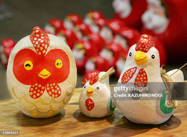 Daruma doll of rooster, next year's Chinese zodiac, are displayed at the Arai daruma studio in Hiratsuka, 21 Decemeber 2004. The year-end marks the...