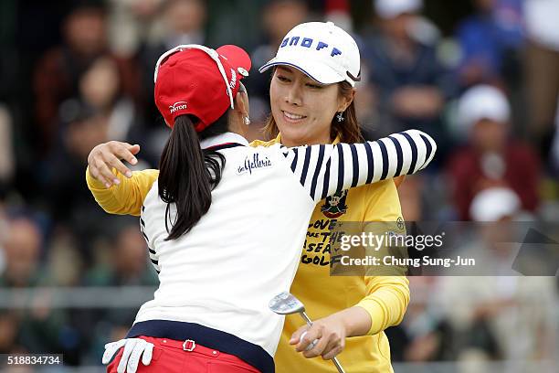 Ji-Hee Lee South Korea hugs with Chae-Young Yoon after a winning putt on the 18th green during the final round of the YAMAHA Ladies Open Katsuragi at...