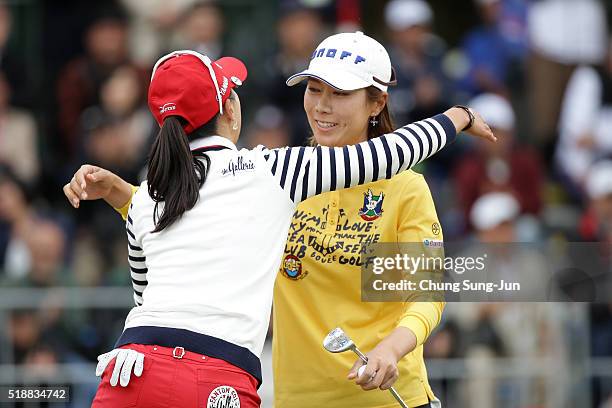 Ji-Hee Lee South Korea hugs with Chae-Young Yoon after a winning putt on the 18th green during the final round of the YAMAHA Ladies Open Katsuragi at...