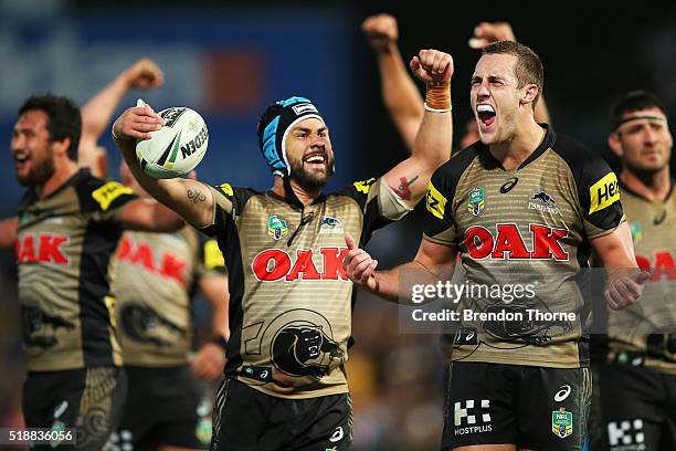 Jamie Soward and Isaah Yeo of the Panthers celebrate after team mate Bryce Cartwright scores the winning try during the round five NRL match between...