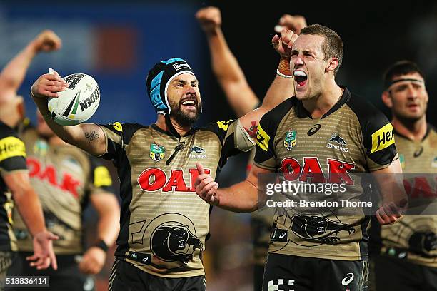 Jamie Soward and Isaah Yeo of the Panthers celebrate after team mate Bryce Cartwright scores the winning try during the round five NRL match between...