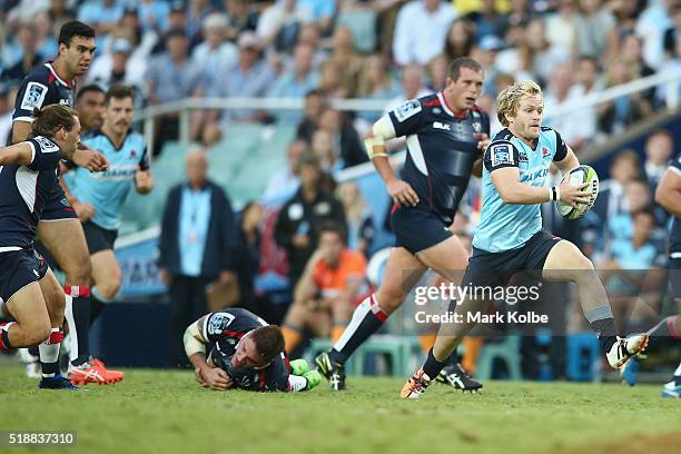 Matt Lucas of the Waratahs makes a break during the round six Super Rugby match between the New South Wales Waratahs and the Melbourne Rebels at...
