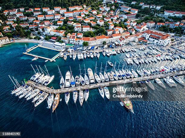 korcula town and marina with sailboats from above - korcula island stock pictures, royalty-free photos & images