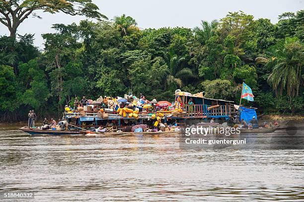 overloaded barge (vessel) on the congo river - dugout canoe stock pictures, royalty-free photos & images