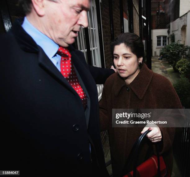 Stephen Quinn and wife Kimberly Quinn walk outside their home on December 21, 2004 in West London, England. Kimberley Quinn is the former lover of...