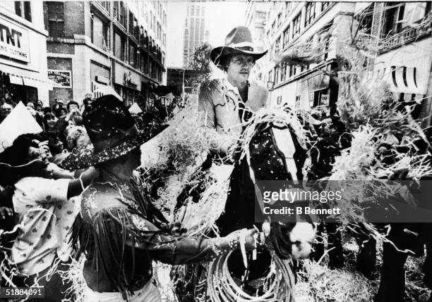 American baseball player George Brett of the Kansas City Royals rides a horse through a ticker-tape parade held in the team's honor, Kansas City,...