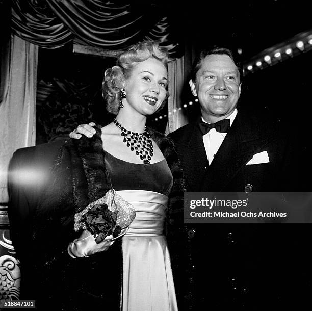 Virginia Mayo and husband Michael O'Shea attends a premiere in Los Angeles,CA.