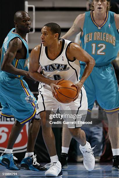 Howard Eisley of the Utah Jazz moves the ball during the game with the New Orleans Hornets on November 22, 2004 at the Delta Center in Salt Lake...