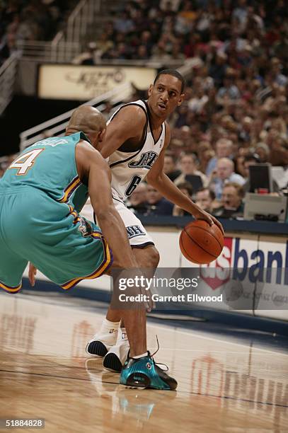 Howard Eisley of the Utah Jazz moves the ball during the game with the New Orleans Hornets on November 22, 2004 at the Delta Center in Salt Lake...