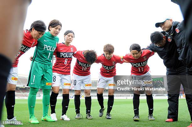 Urawa Reds players form a huddle prior to the Nadeshiko League match between Urawa Red Diamonds Ladies and Albirex Niigata Ladies at the Saitama...