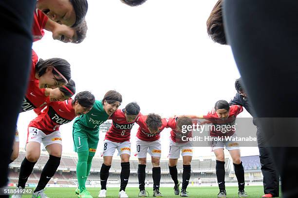 Urawa Reds players form a huddle prior to the Nadeshiko League match between Urawa Red Diamonds Ladies and Albirex Niigata Ladies at the Saitama...