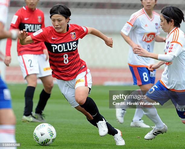 Hikaru Naomoto of Urawa Reds and Haruka Takahashi of Albirex Niigata compete for the ball during the Nadeshiko League match between Urawa Red...