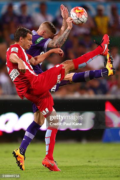 Alex Wilkinson of Melbourne and Andy Keogh of the Glory contest for the ball during the round 26 A-League match between the Perth Glory and Melbourne...