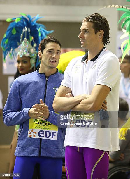 Winner Camille Lacourt and second Benjamin Stasiulis wait for the medals ceremony for the men's 100m backstroke final during day 5 of the French...