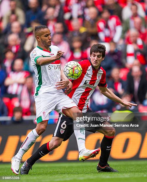 Mikel San Jose of Athletic Club Bilbao competes for the ball with Youssef El Arabi of Granada CF during the La Liga match between Athletic Club...