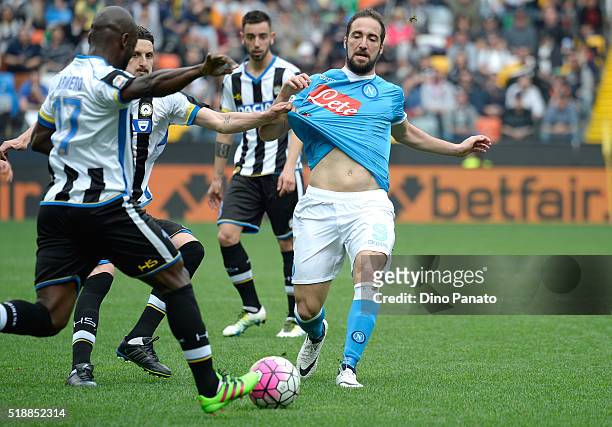 Zdravkob Kuzmanovic and Pablo Estifer Armero of Udinese Calcio compete with Gonzalo Higuain of SSC Napoli during the Serie A match between Udinese...
