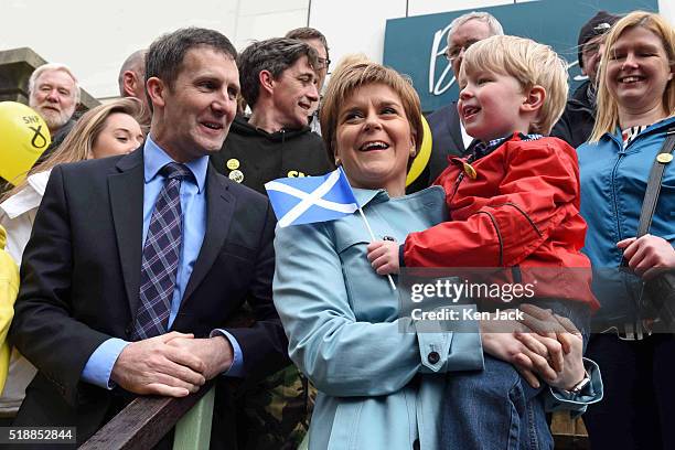 Scottish First Minister Nicola Sturgeon poses for a photograph with John Clark from Dunipace, and local candidate Michael Matheson as she campaigns...