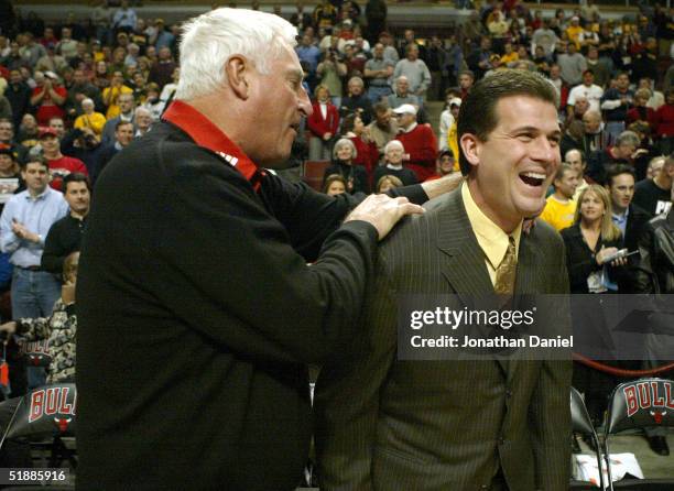 Head coach Bob Knight of Texas Tech gets a laugh out of his former Indiana player and now head coach of Iowa, Steve Alford before their game on...