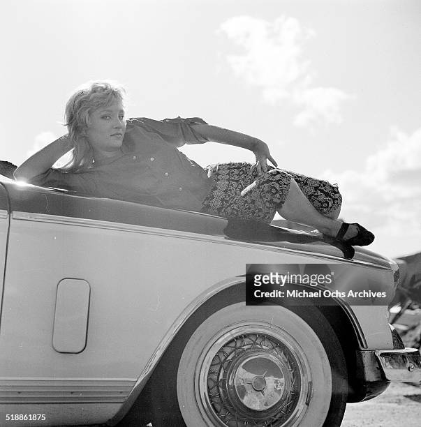 Susan Oliver poses for a portrait on a car in Los Angeles,CA.