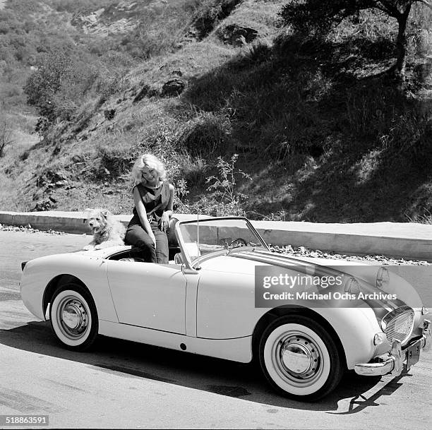 Yvette Mimieux poses for a portrait with a car in Los Angeles,CA.