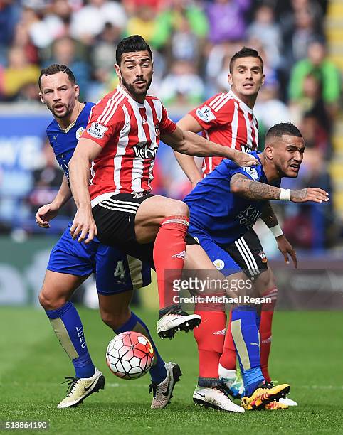 Graziano Pelle and Dusan Tadic of Southampton watch the ball with Danny Drinkwater and Danny Simpson of Leicester City during the Barclays Premier...