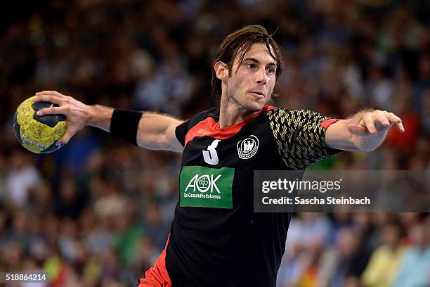 Uwe Gensheimer of Germany throws the ball during the handball international friendly match between Germany and Austria at Schwalbe arena on April 3,...