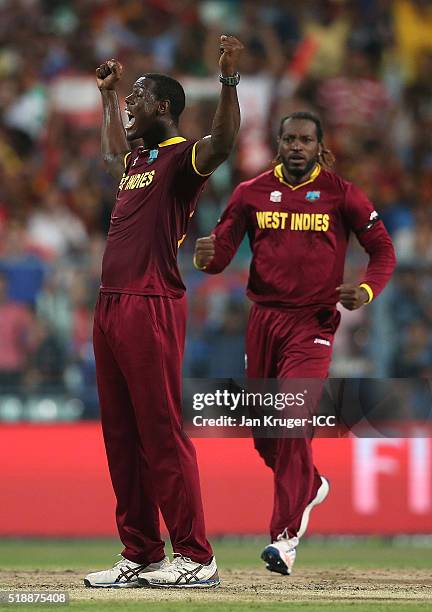 Carlos Brathwaite of the West Indies celebrates the wicket of Jos Buttler of England during the ICC World Twenty20 India 2016 final match between...