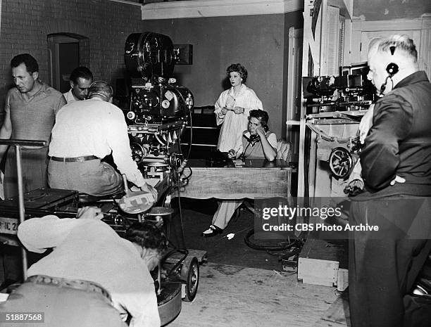 American actress Lucille Ball , her husband, Cuban-born American musician and actor Desi Arnaz , and the film crew on the set of the television...