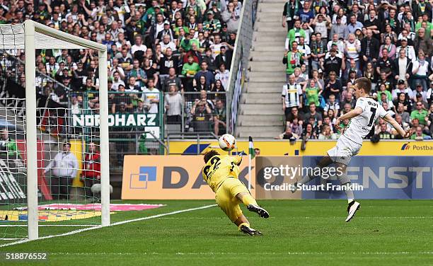 Patrick Herrmann of Borussia Moenchengladbach shoots past goalkeeper Rune Almenning Jarstein of Hertha Berlin to score their thrid goal during the...