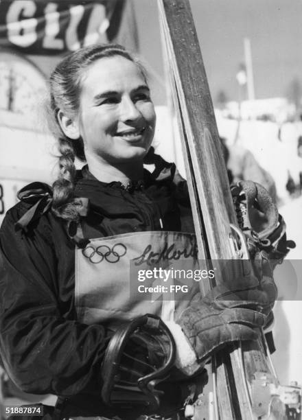 American skier Gretchen Fraser holds a pair of skis as she poses for a portrait during the V Winter Olympic Games, February 1948, St. Moritz,...