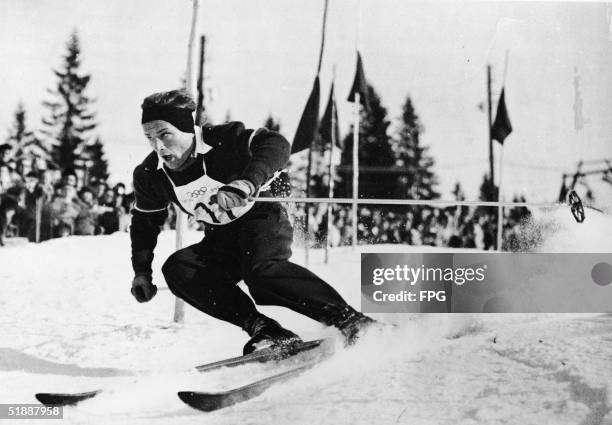 Austrian skier Othmar Schneider at speed as he wins the Men's Slalom during the VI Winter Olympic Games, Rodkleiva, Norway, February 21, 1952.